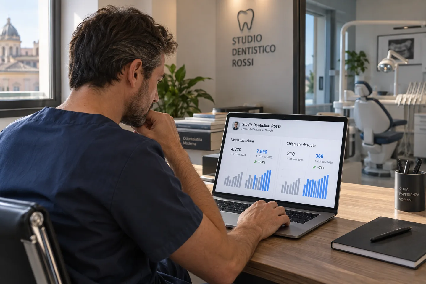 Il titolare di uno studio dentistico consulta da un laptop le statistiche della propria scheda Google Business Profile, visualizzazioni e chiamate ricevute a confronto tra due periodi.